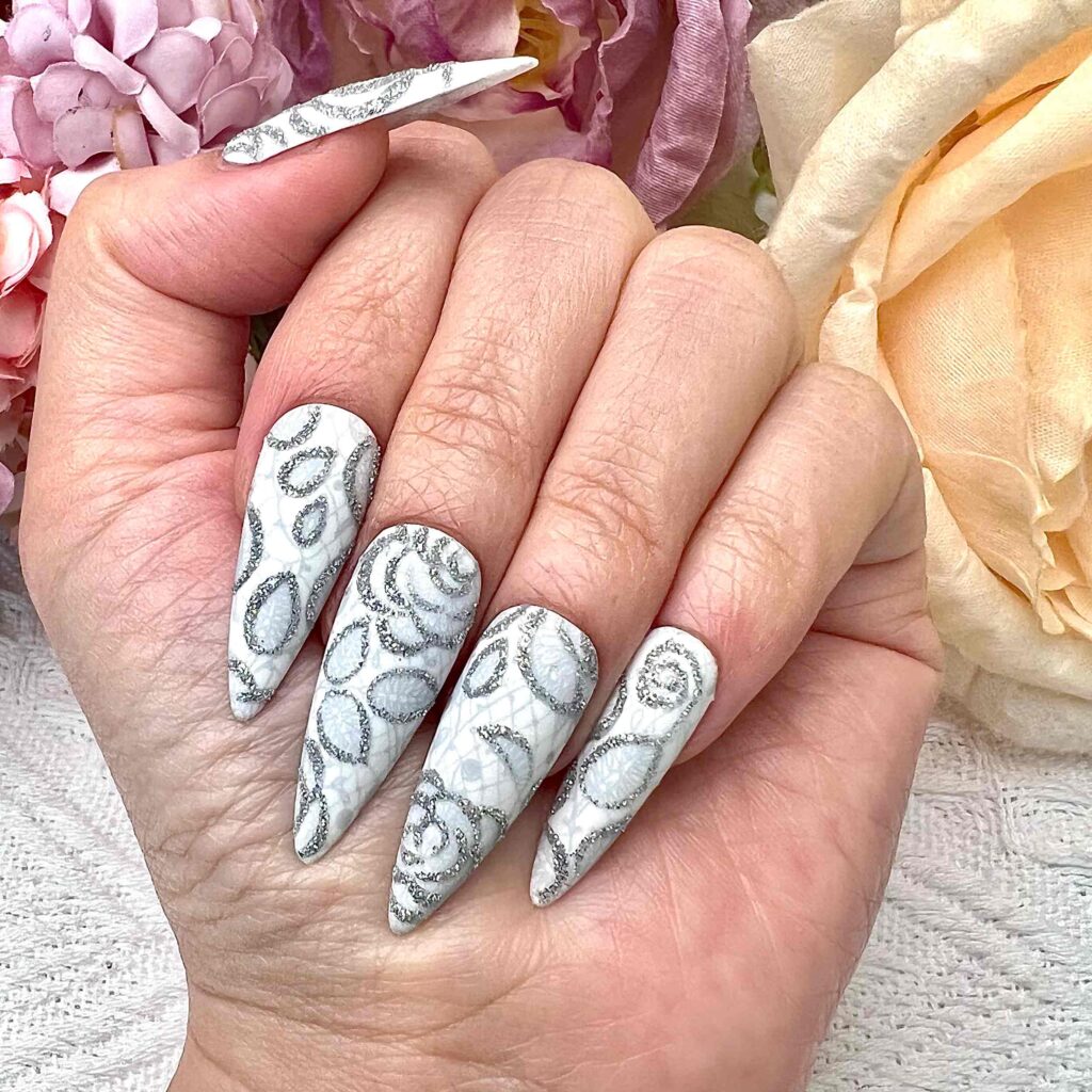 Silver filigree rose nail,